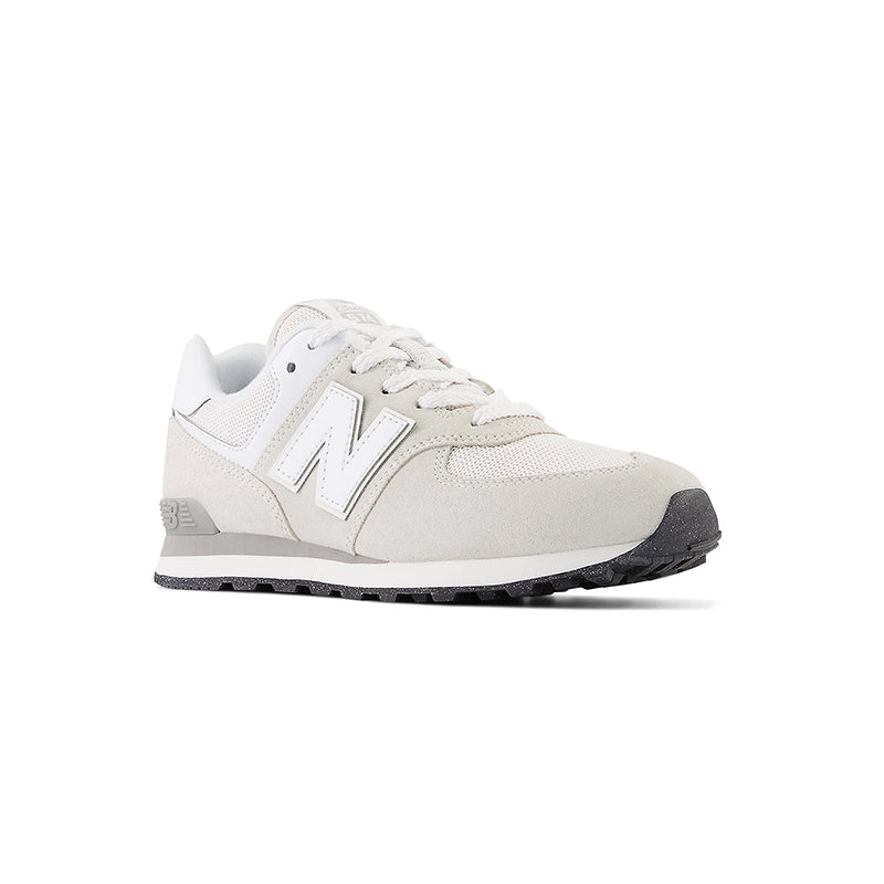 Angled side view of New Balance Kid's Grade School 574 Sneaker in Grey/White.