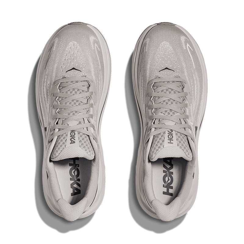 Gray running shoes with 'Hoka' branding on a white background
