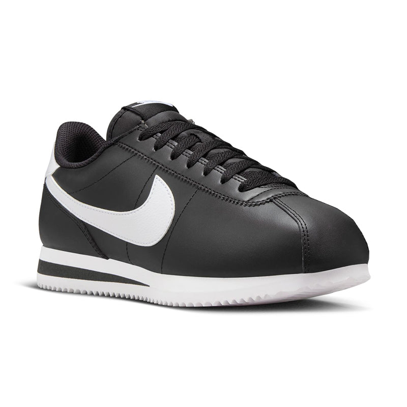 Angled side view of Nike Women's Cortez sneaker in black/white.