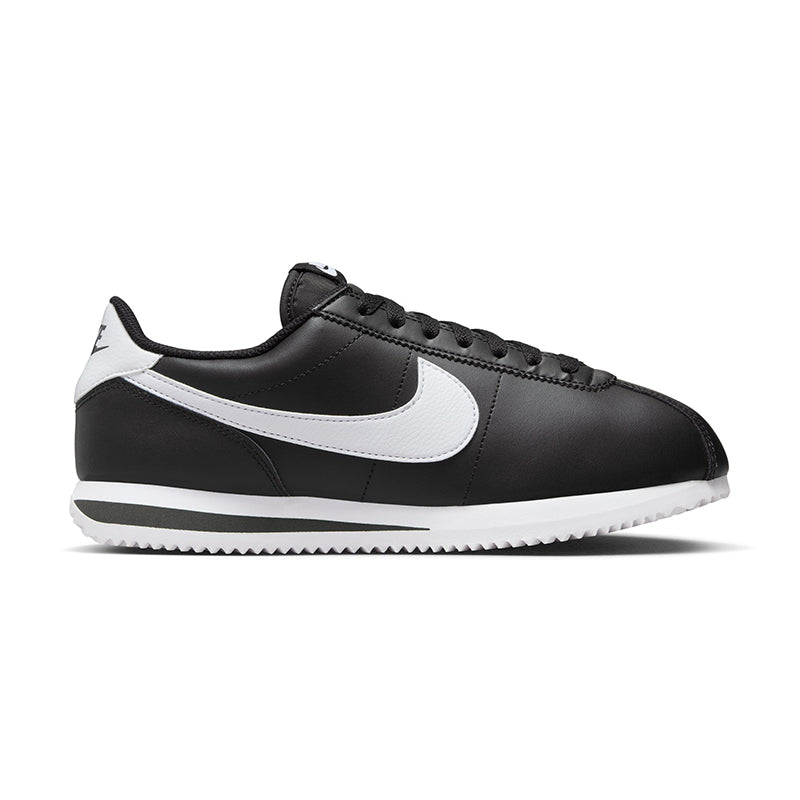 Side view of Nike Women's Cortez sneaker in black/white.