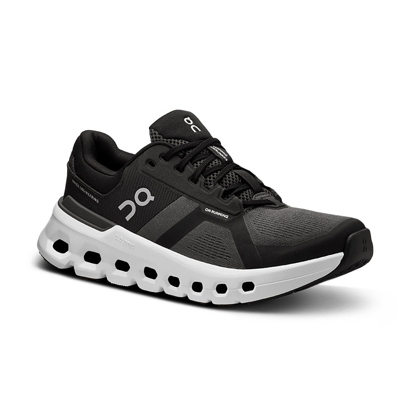 A black and gray men's running shoe with a mesh upper, foam midsole, and rubber outsole featuring holes for traction.