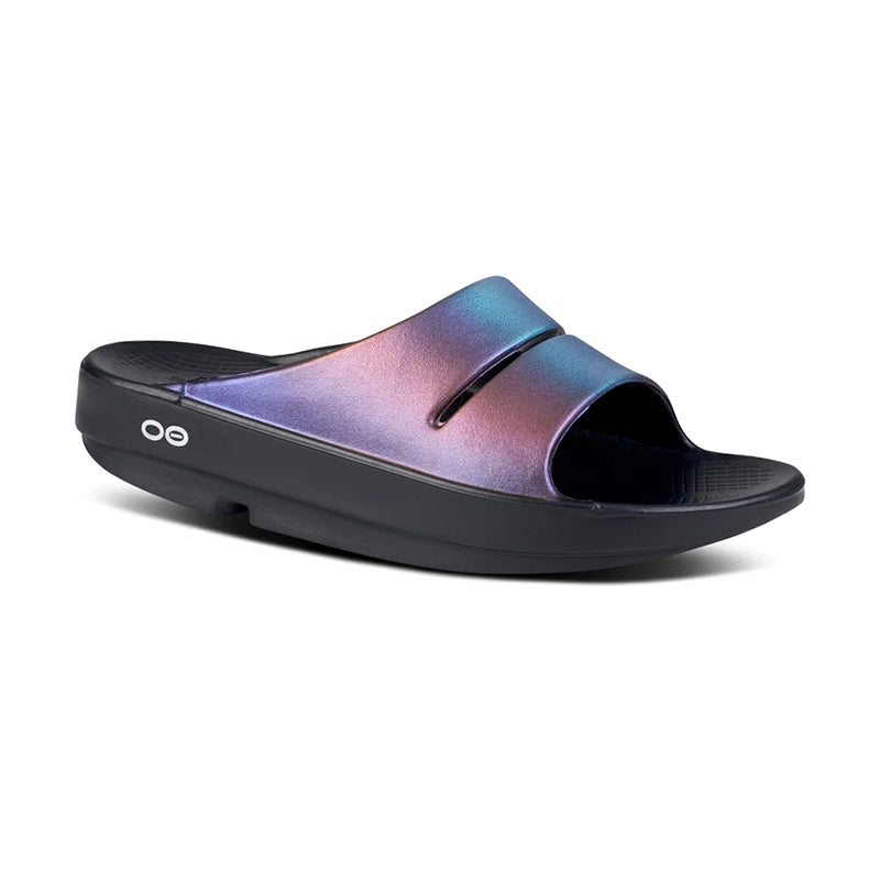 Angled side view of OOFOS Women's OOahh Luxe Slide sandal in midnight spectre.