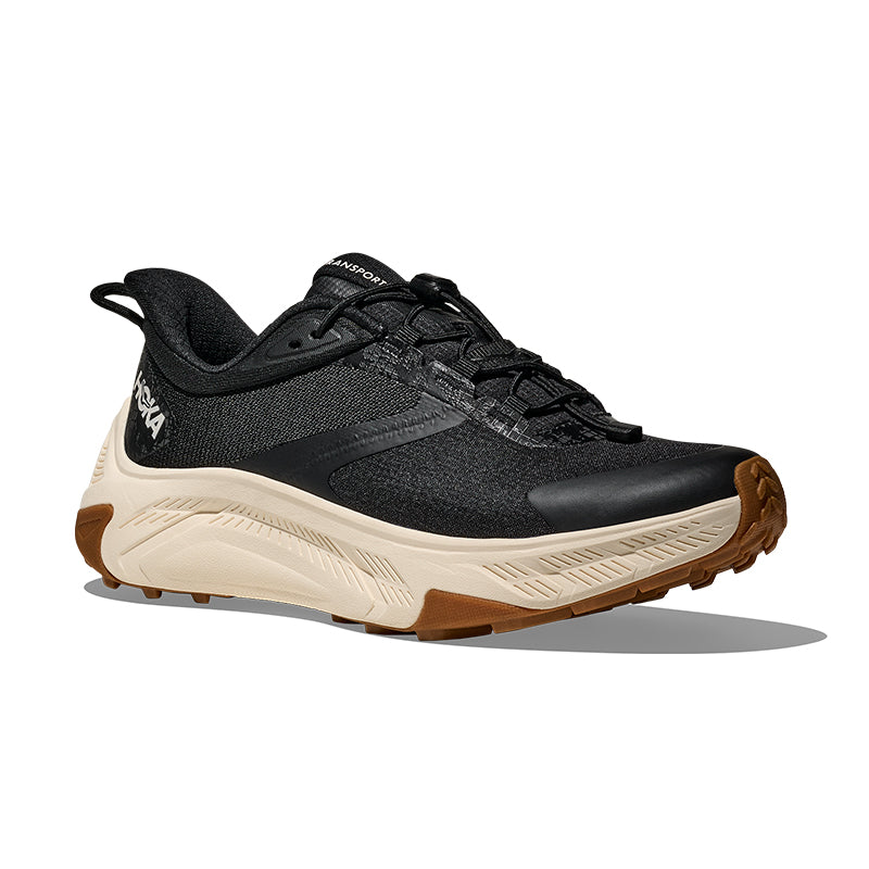 Black and brown athletic shoe on a white background