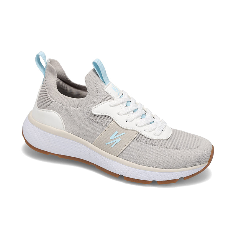 Angled side view of Rival Women's Reign sneaker in Greige/Light Blue/Gum.