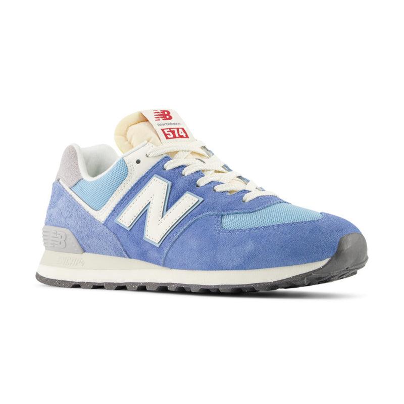 Angled side view of New Balance Women's 574 Sneaker in Alpine Blue/ White.
