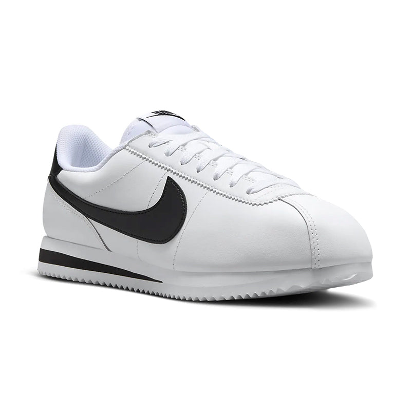 White sneaker with black swoosh logo on a white background