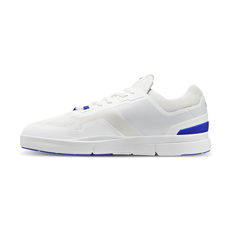 Side view of On Running Men's The Roger Spin Sneaker in Undyed/Indigo.